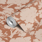Silhouette pattern of trees and woodland scenery in beige on terracotta background