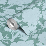 Underwater coral reef scene in sage green and light blue with silhouettes of sea life and coral form