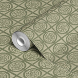 Decorative green geometric pattern on beige background with repeating ornate medallions and grid des