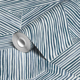 Abstract geometric pattern of intersecting diagonal and vertical lines in blue on white background