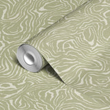 Abstract swirling pattern in white lines on sage green background, resembling flowing water or natur