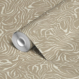 Swirling abstract pattern in tan and white resembling wood grain or marble texture