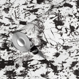 Abstract black and white speckled texture with irregular organic patterns and high contrast