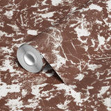 Brown and white speckled pattern with irregular organic shapes creating a mottled texture