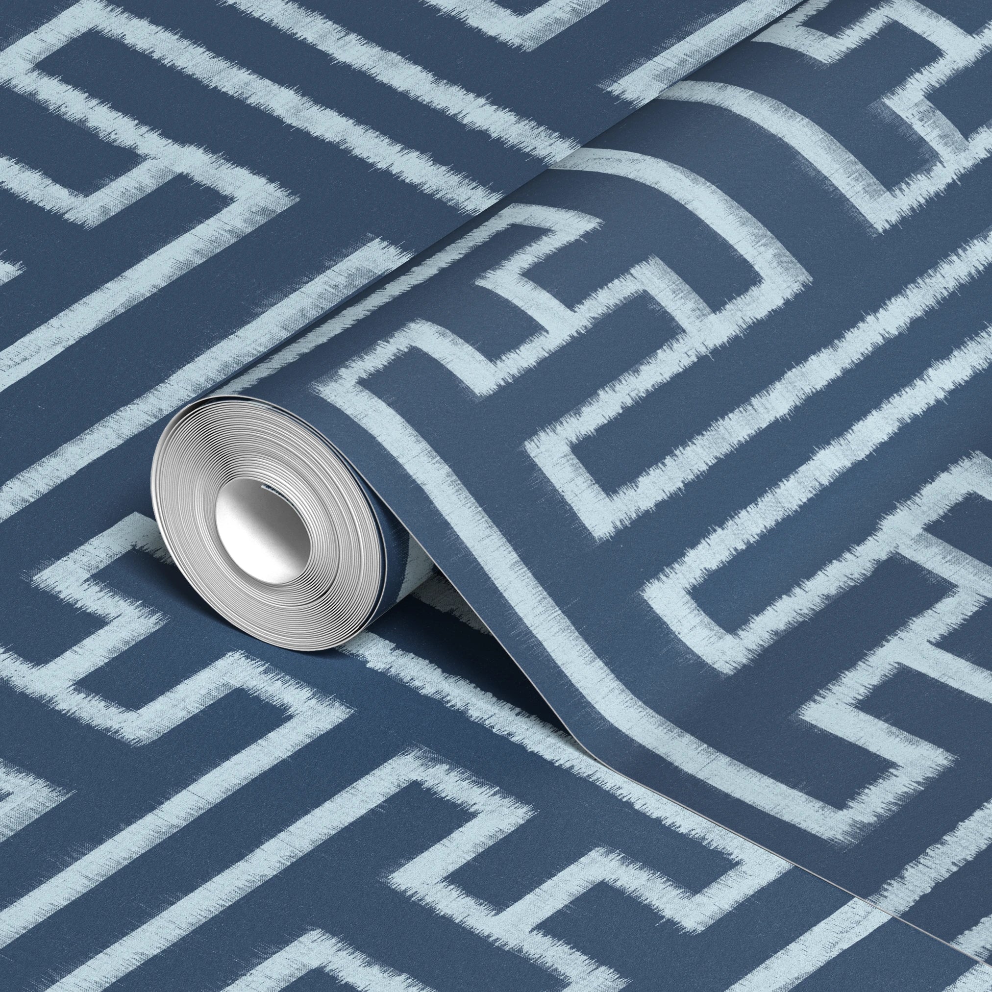 White geometric Greek key pattern on dark blue background