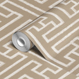 Greek key pattern in white on beige background with geometric maze-like design